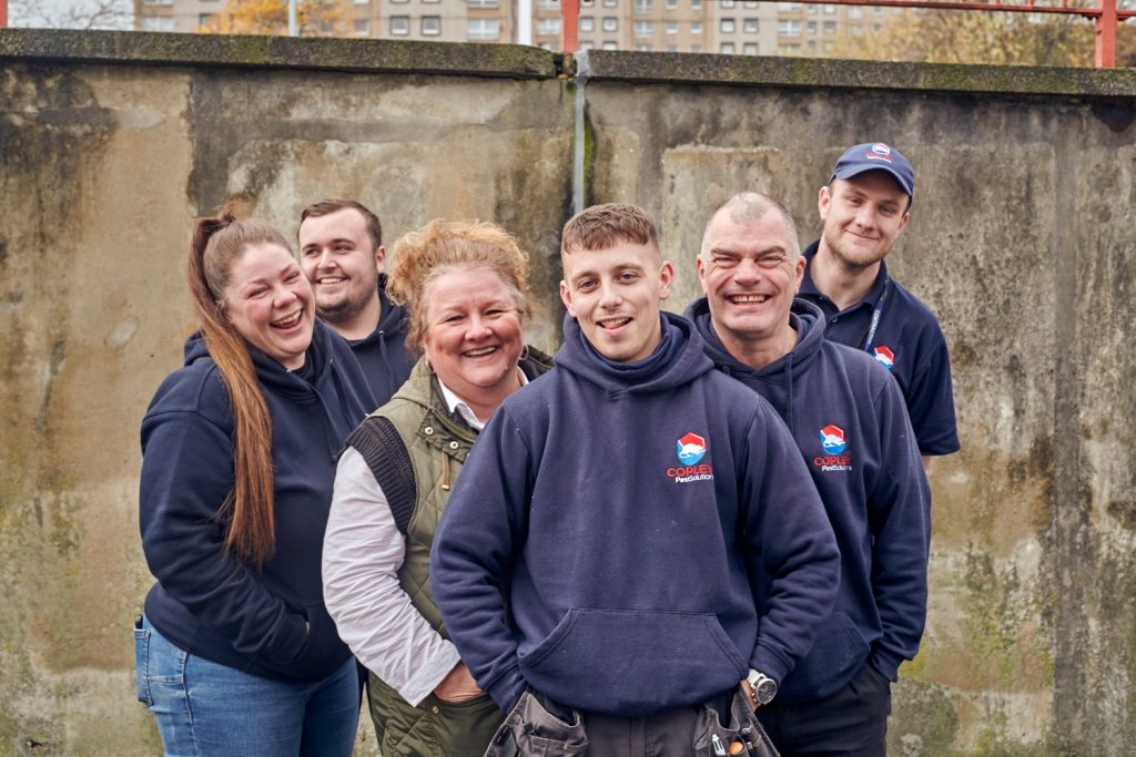 Team of Copley Pest Solutions UK Cryptocurrency staff wearing branded jumpers